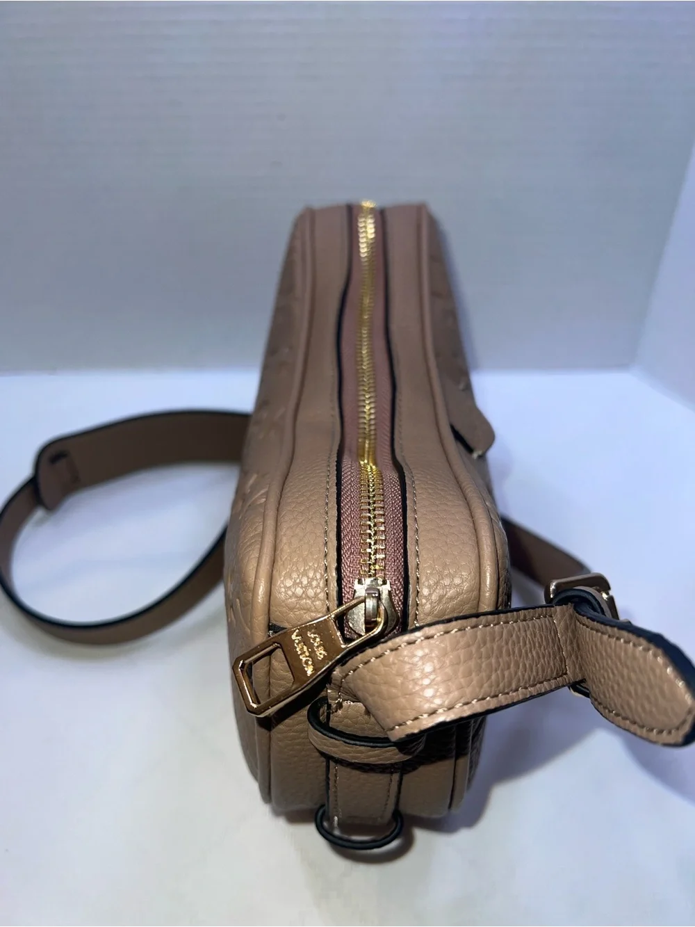Designer inspired half-moon shoulder bag in a neutral taupe leather w/monogram